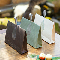 Boîte à thé en carton écologique simple avec poignée robuste, conception d'emballage cadeau personnalisée pour thés en vrac frais