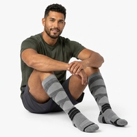 Chaussettes de ski en laine mérinos tricotées ODM, épaisses et thermiques pour l'hiver, avec logo personnalisé, chaussettes de basketball longues, chaussettes athlétiques montantes jusqu'au genou