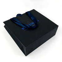 Sacs en papier noir de luxe pour cadeaux, emballages de vêtements, sacs de shopping européens biodégradables et recyclables pour les petites entreprises