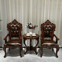 Fauteuil de loisirs en cuir véritable de première qualité de style européen avec accoudoirs sculptés et petite table intégrée pour salon et bureau