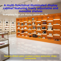 Vitrine à chaussures lumineuse orange, fabriquée à la main, avec revêtement en poudre, pour centres commerciaux, design personnalisable, pour entreprises