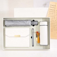 Coffrets cadeaux promotionnels personnalisés : parapluie, carnet et stylo avec tasse isotherme pour promotion