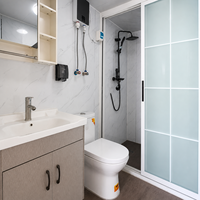 Maison conteneur extensible bleue avec structure blanche, maison modulaire, villa méditerranéenne avec vue sur la mer de Santorin, vente en gros OEM