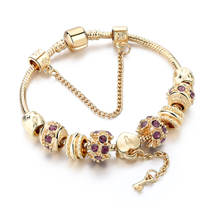 Bracciale con perline Color oro con ciondolo a forma di cuore in cristallo viola e bracciale con ciondolo a chiave - Product Image 1