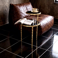 Table d'appoint ronde moderne à 2 niveaux, structure en métal doré martelé, plateau en bois noir, table basse d'appoint de luxe pour salon