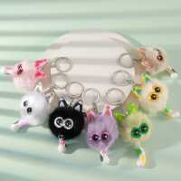 Porte-clés tendance le plus vendu, avec pompon en métal argenté, structure duveteuse, garniture oreille de pêche, breloque œil d'étoile et queue de chat