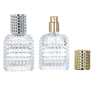 Botella de Perfume de Vidrio Transparente con Relieve Brillante, 50ml 100ml, Recargable, con Tapa de Spray Dorada/Plateada, en Oferta - Product Image 1