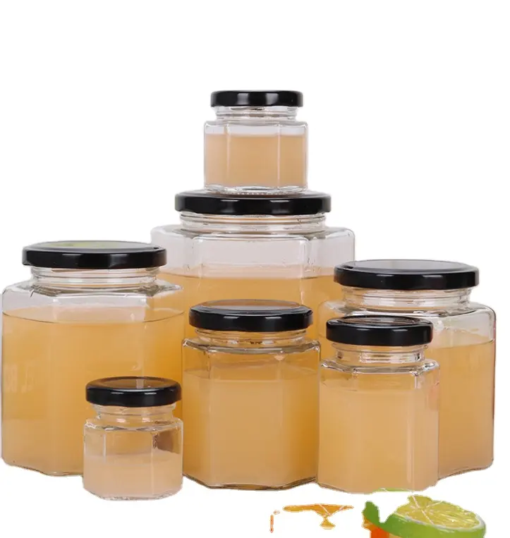 Vasetti di bottiglie di vetro vuoti esagonali vaso di miele in vendita vaso di miele in vetro vaso di marmellata con coperchio in metallo a vite