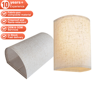 Lampada da tavolo moderna e minimalista con base in vetro e paralume a tamburo in tessuto grigio