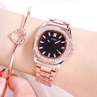 Montre à quartz pour femme avec lunette sertie de cristaux, cadran texturé, index lumineux, fenêtre de date et bracelet à maillons en H