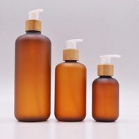 Botol PET Amber Frosted Grosir 150ml 200ml 250ml 500ml dengan Tutup Bambu untuk Kemasan Kosmetik Lotion Sampo Logo Custom