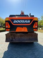 Excavatrice sur pneus Doosan DX210W d'occasion, 20 tonnes, d'origine coréenne, pour travaux routiers