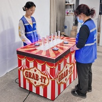 Machine de jeu interactive personnalisée Carnival Grab It Game pour la location d'événements, les fêtes, l'activation de marque et les attractions FEC
