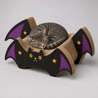 Lit pour chat incurvé en carton ondulé avec découpes en forme d'étoile, style aile de chauve-souris