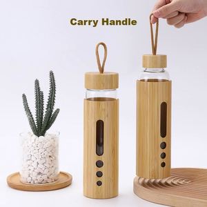 Bouteilles d'eau en verre personnalisées durables de 34 oz avec logo, couvercle en bambou et poignée de transport pour les événements de conférence et scolaires - Product Image 4