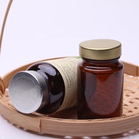Bouteille de pilules en verre dépoli de haute qualité 100cc 200cc 300cc bouteille en verre sodocalcique moulée bleu ambre pour supplément avec couvercle en métal
