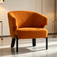 Fauteuil club incurvé avec accoudoirs découpés et pieds intégrés |   Fauteuil baril moderne en tissu terracotta avec accent en velours et découpes