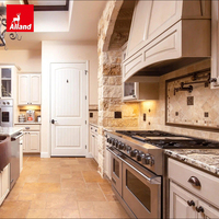 Ensemble d'armoires de cuisine Alland Building Materials, style classique du vieux monde, blanc, avec plans de travail en granit.