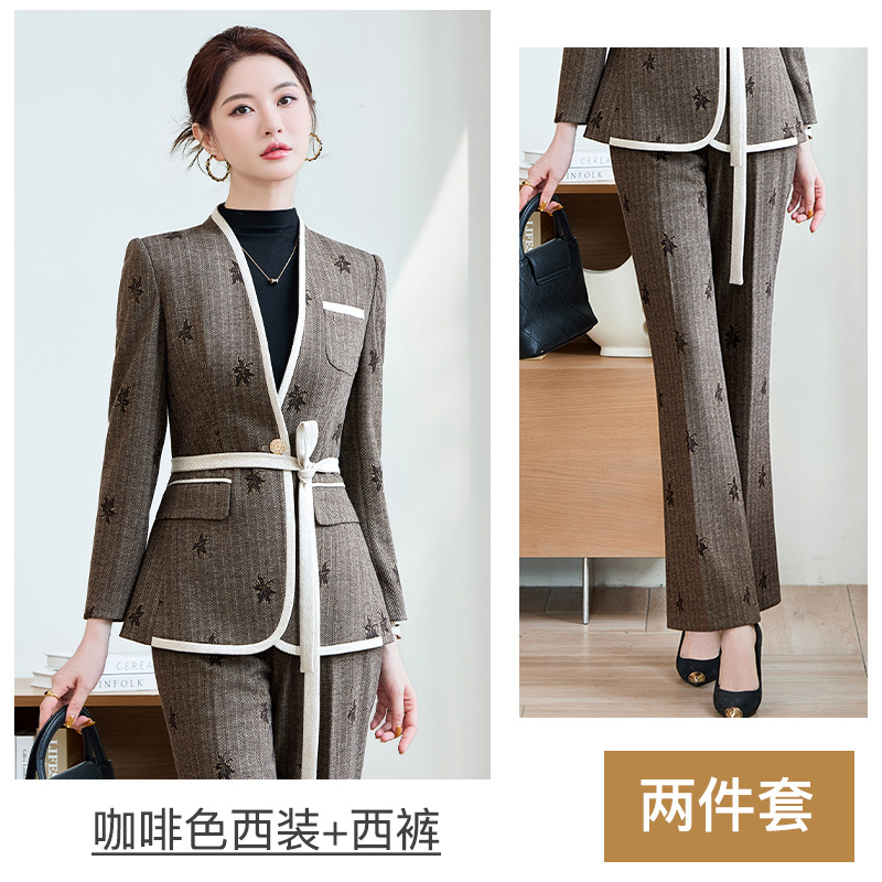 Coffee-colored suit with slightly flared trousers and belt