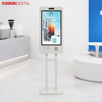 Kiosco de autoservicio con pantalla táctil en japonés para pedidos digitales, montado en la pared, para tiendas de comida rápida.