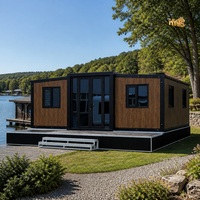 Casa Contenedor Modular Prefabricada Impermeable HeYing, Estructura Negra, Techo Inclinado, Diseño Moderno, Tamaño Personalizable, Hotel, Tienda, Villa