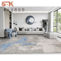 Tapis moderne en polypropylène ultra doux de 12 mm d'épaisseur, motif bleu glacé, effet aquarelle dégradé, brillance soyeuse Liuli