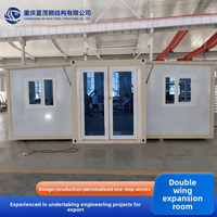 Conteneur de maison préfabriquée pliable à double aile de 20 pieds, espace de vie mobile et détachable, grande surface extensible de haute qualité