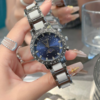 Montre de luxe pour femme, design soleil, lune et étoiles, diamants incrustés, calendrier intégré, en acier allié et céramique, résistante à l'eau, aiguilles