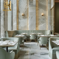 Mobilier de restaurant Ron Group : banquette en velours, table carrée en marbre, chaise personnalisée pour restaurant