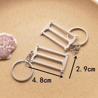 Porte-clés mini-outils en métal, design créatif clé à molette, marteau, tournevis, pelle, pendentif pour sac de voiture, petit cadeau promotionnel
