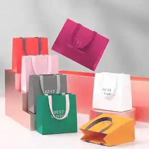 retail custom pink paper kraft paper bags with your own logo cardboard personalized white gift bags for business