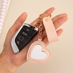 2025 Vintage Style Luxury PU <b>Leather</b> Flower Heart Bag Charm <b>Keychain</b> Creative Zinc Alloy Mirror Car Bag Pendant Keyring Gifts - Product Image 3