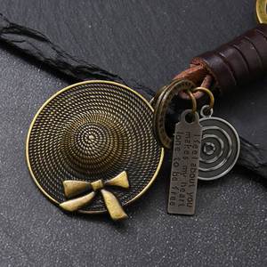 Accesorios de tejido genuinos para colgar en bolsos, regalos al por mayor, colgante de lazo retro para sombrero de paja, llavero de metal - Product Image 2