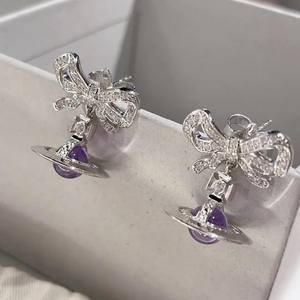 Pendientes Vivienne Purple Bow 3D Planet Drop, Aleación con Diamantes de Zirconia, Diseño de Saturno, Elegantes y Lujosos, Unisex - Product Image 1