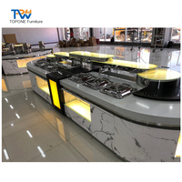 Comptoir buffet incurvé moderne en marbre avec éclairage LED, table de bar libre-service pour hôtel, mobilier commercial personnalisé pour centre commercial et hôpital