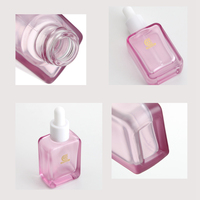 Flacon compte-gouttes en verre transparent rose à fond épais de 30 ml vide en gros pour l'emballage cosmétique