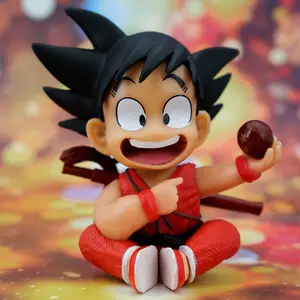 XM dos siete figuras de acción infancia Son Goku sosteniendo Dragoned a Ball muñeca Decoración de Pastel de juguete