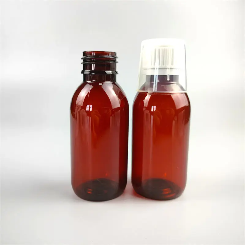 Botella de plástico de jarabe para la tos farmacéutico redondo ámbar vacío de 100ml con tapa de plástico a prueba de manipulaciones/taza de conteo