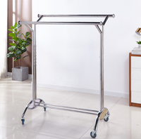 Porte-vêtements pliable télescopique sur pied réglable, support de séchage et de rangement en métal de luxe.