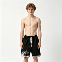 Shorts graphiques noirs style streetwear effet délavé, ourlet déchiré, coupe ample, bas de tenue d'été pour hommes, service de personnalisation de logo de haute qualité