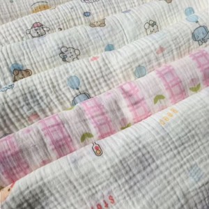 Tissu en mousseline <span class=keywords><strong>de</strong></span> <span class=keywords><strong>coton</strong></span> biologique tissé 120 g/m², double <span class=keywords><strong>gaze</strong></span>, crêpe, vente en gros d'usine, pour emmaillotement <span class=keywords><strong>de</strong></span> bébé, <span class=keywords><strong>chemise</strong></span> pour filles et robe pour garçons - Product Image 1