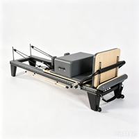 Reformer de Pilates portable et réglable noir avec cadre en alliage d'aluminium pour usage domestique et petits studios de fitness