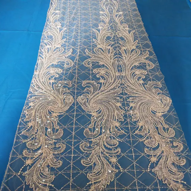 Guangzhou fabrika özel fildişi boncuklu işlemeli tül gelin dantel kumaş için düğün elbisesi
