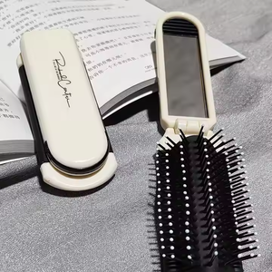 Al por mayor, peine plegable mini personalizado <span class=keywords><strong>con</strong></span> espejo de <span class=keywords><strong>maquillaje</strong></span>, diseño de dibujos animados bonito, mango de plástico, cepillo para el cabello plegable para peine de cojín de aire - Product Image 1