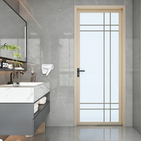 Porte battante en verre au design moderne avec matériau en alliage d'aluminium coupe-vent pour décoration intérieure d'hôtel