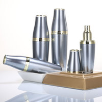 Expédition rapide, produit unique et populaire, flacon de crème en acrylique vide de luxe gris avec pompe dorée, pot de crème en forme de boule