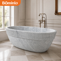 Baignoire autoportante circulaire en marbre blanc de qualité supérieure, à rebord cannelé, sculptée à la main, veinée de gris, pour hôtel, spa, villa