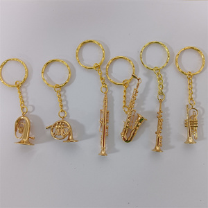 Venta caliente instrumentos <span class=keywords><strong>de</strong></span> viento cuerno francés clarinete <span class=keywords><strong>corneta</strong></span> saxofón diseño oro llavero encantos lindo exquisito llaveros <span class=keywords><strong>de</strong></span> Metal - Product Image 1