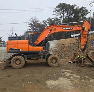 รถขุดล้อยี่ห้อ Doosan รุ่น DX140W มือสอง น้ำหนัก 14 ตัน รถขุดล้อแท้จาก Doosan ชั่วโมงการทำงานต่ำ ขาย - Product Image 1