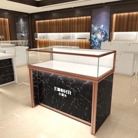 Mostrador de tienda minorista de oro de lujo, mesa de exhibición de diseño, joyería, muebles, escaparates de joyería de cristal, luces Led